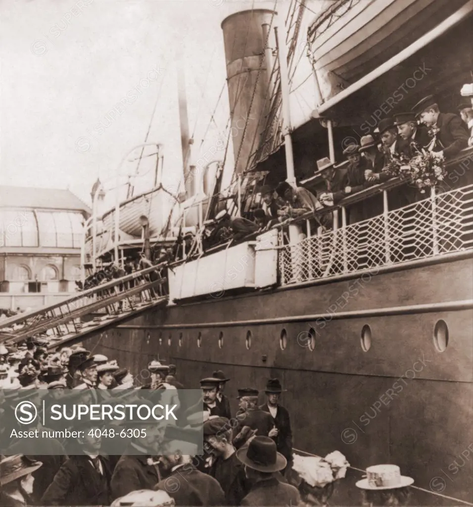 Crowd at the pier sees off the S.S. ANGELO, of the Wilson Line steamship line, leaving Oslo, Norway, with emigrants for America. Ca. 1905.