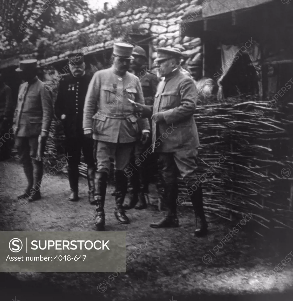 Raymond Poincare, President of the French Republic, and Marshal Joseph Jacques Cesaire Joffre visiting the front during the Battle of the Somme, 1916