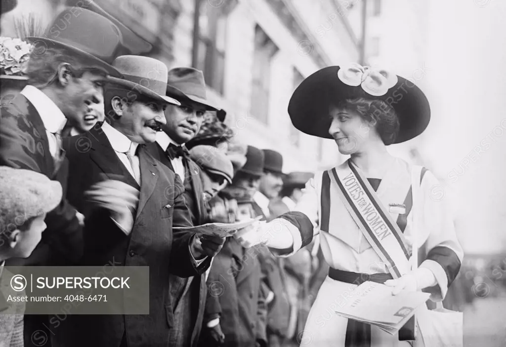Inez Milholland (1886-1916), selling Feminist papers to bystanders at Suffragette parade in New York City. Ca.1913-16. Julia Ormond played Millholland in the 2004 movie IRON JAWED ANGELS.