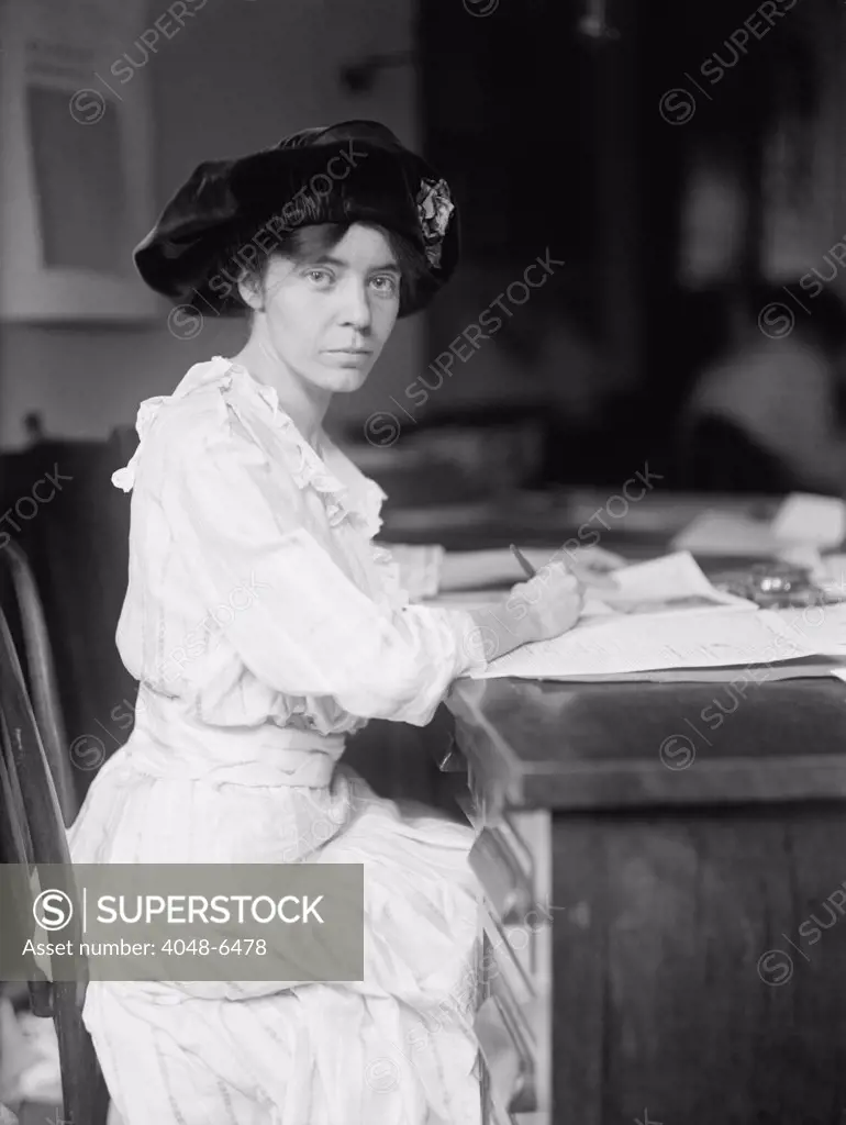 Alice Paul (1885-1977), militant American Suffragette leader and feminist at her desk in 1915. She was jailed three times in her protests for the ratification of the Nineteenth Amendment in 1920. In 1923 she drafted the first proposed equal rights amendment to the Constitution.