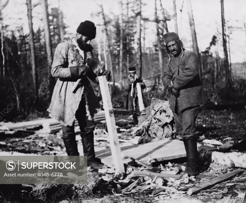 Three Russian convicts building a camp near the Eastern Siberian Railroad. Throughout the 19th century, Russia populated its easternmost territories with political and criminal prisoners. Ca. 1895 photo by William Henry Jackson.