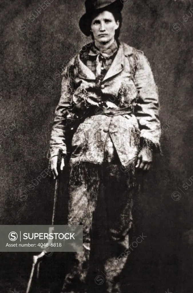 Calamity Jane (1852-1903), dressed in buckskins, posed for a studio portrait. Ca. 1885.