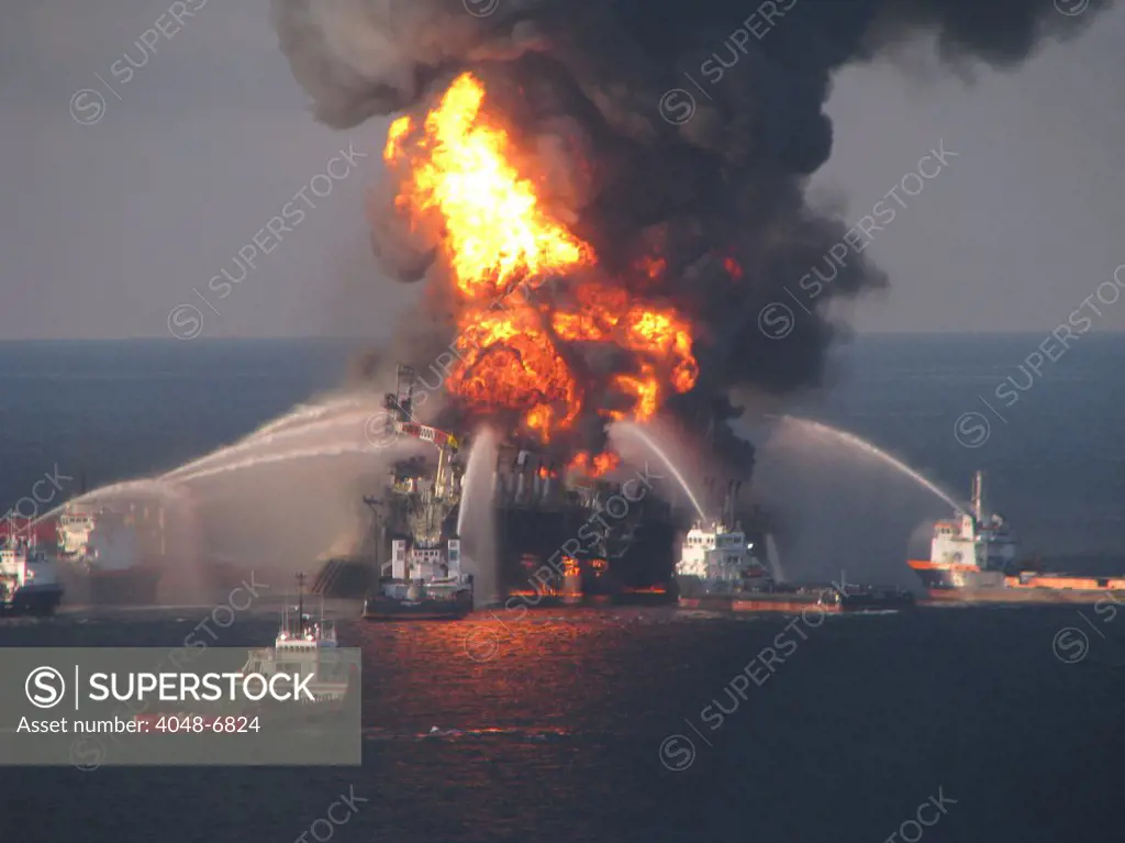 British Petroleum (BP) Oil Company's Deepwater Horizon, the offshore drilling rig is surrounded by U.S. Coast Guard fire boats on April 21, 2010. 11 workers were killed and mile deep gusher polluted the Gulf of Mexico for months.