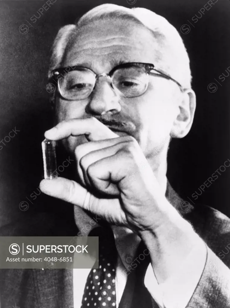 Dr. Albert Sabin (1906-1993), holding vial containing a live-virus vaccine for polio he developed to supplement, and ultimately replace, Jonas Salk's killed virus vaccine. 1959.