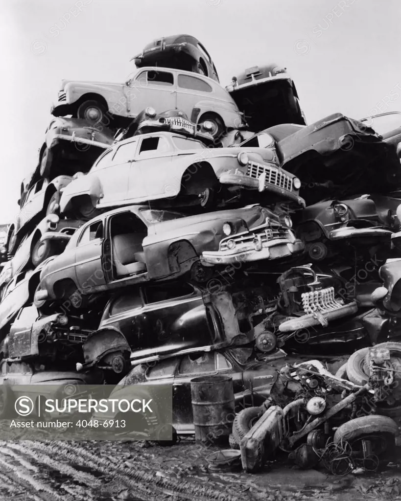 Pile of discarded automobiles in a junkyard in New York City, 1957.