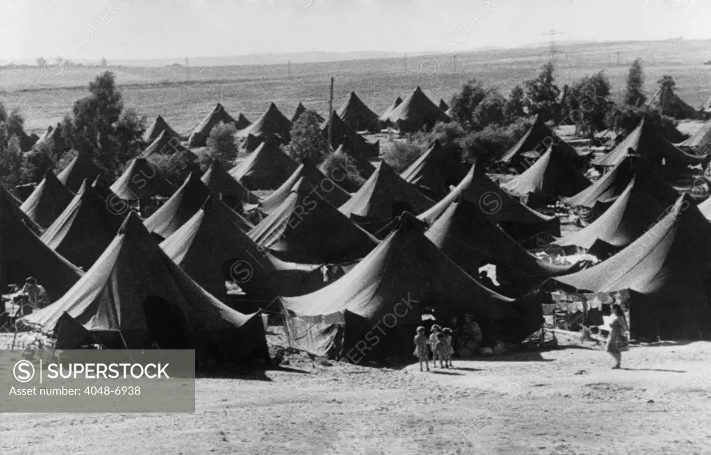 Tents used as temporary housing for Jewish immigrants in Israel. From 1948 to 1951, over 700,000 immigrants entered Israel, most were Holocaust survivors or Jews fleeing Arab lands. Ca. 1950.