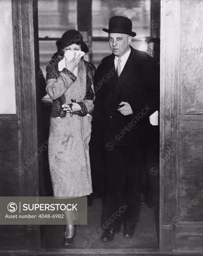Mrs. Vincent Coll with her husband's famous defense attorney Samuel Leibowitz. 'Mad Dog' Coll was acquitted of the murder of a five year old bystander during Coll's attempted kidnapping of gangster Joey Ral. 1931.