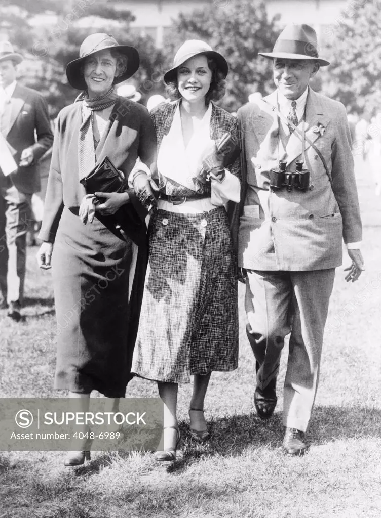 After getting away with murder, Grace Fortescue with her daughter, Helene, and her husband, Major Granville R. Fortescue, at Belmont Park, Long Island, N.Y. on May 30, 1932.