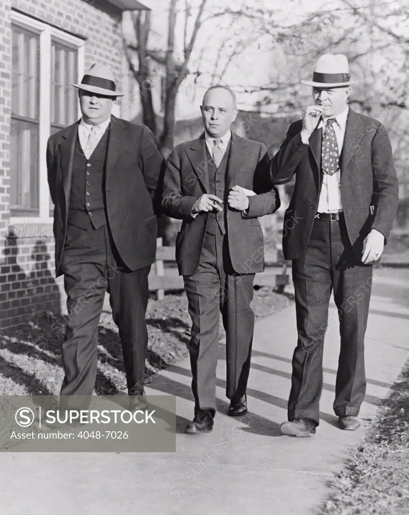 Samuel S. Leibowitz (1893-1978), attorney for the Scottsboro defendants, flanked by court appointed bodyguards in 1933.  Leibowitz worked for the next four years on the case without pay in spite of death threats.
