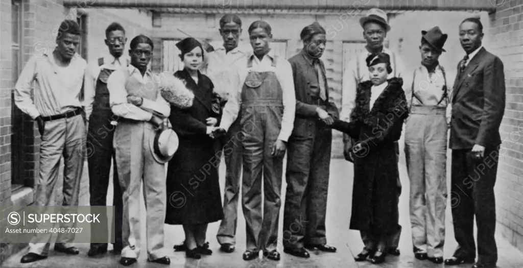 Juanita E. Jackson of the NAACP visiting Scottsboro boys, in Jefferson County Jail in Birmingham, Alabama, on Nov 20, 1936.  Left to right: Ozie Powell, Olen Montgomery, Willie Robinson, Miss Jackson, Charlie Weems, Clarence Norris, Haywood Patterson, Miss Laura Kellum of the Birmingham NAACP youth council, Andy Wright, Eugene Williams, Dr. E.W. Taggart, Pres. of the Birmingham NAACP.  Roy Wright, brother of Andy, refused to have his picture taken.