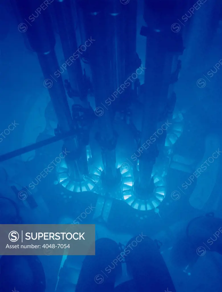 Idaho National Laboratory's Advanced Test Reactor core powered up, with the fuel plates glowing bright blue. The core is submerged in water for cooling.