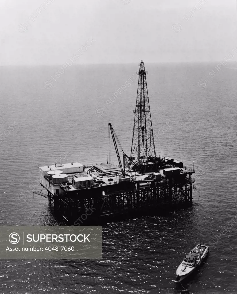 Humble Oil & Refining Company offshore drilling platform in the Gulf of Mexico, located on the tidal oil lands bordering Louisiana and Texas. 1950.