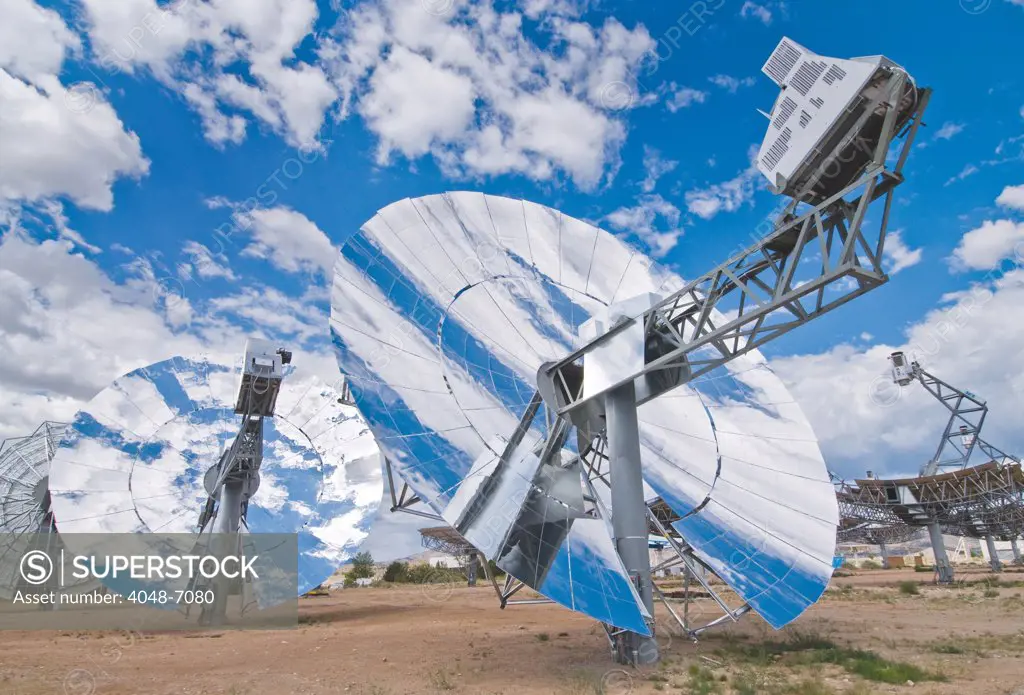 Four newly designed solar power collection dishes at Sandia National Laboratory in 2009. The new dishes are designed for high-volume production, ease of maintenance, and could be in commercial service by 2010.