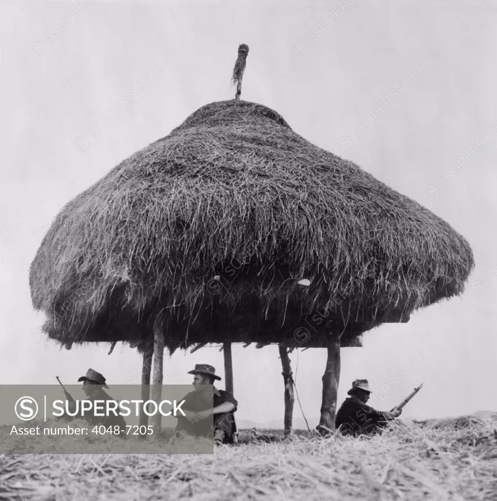 French Foreign Legion soldiers keeping lookout for Viet Minh fighters under the shelter of a thatched radio hut in 1951.The French Indochina War (1946-1954) was the first phase of Vietnam's thirty year struggle for unification against Western powers.
