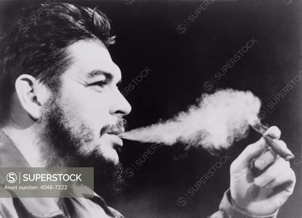 Ernesto 'Che' Guevara (1928-1967), exhaling plume of cigar smoke. 1964 photo taken in New York City.
