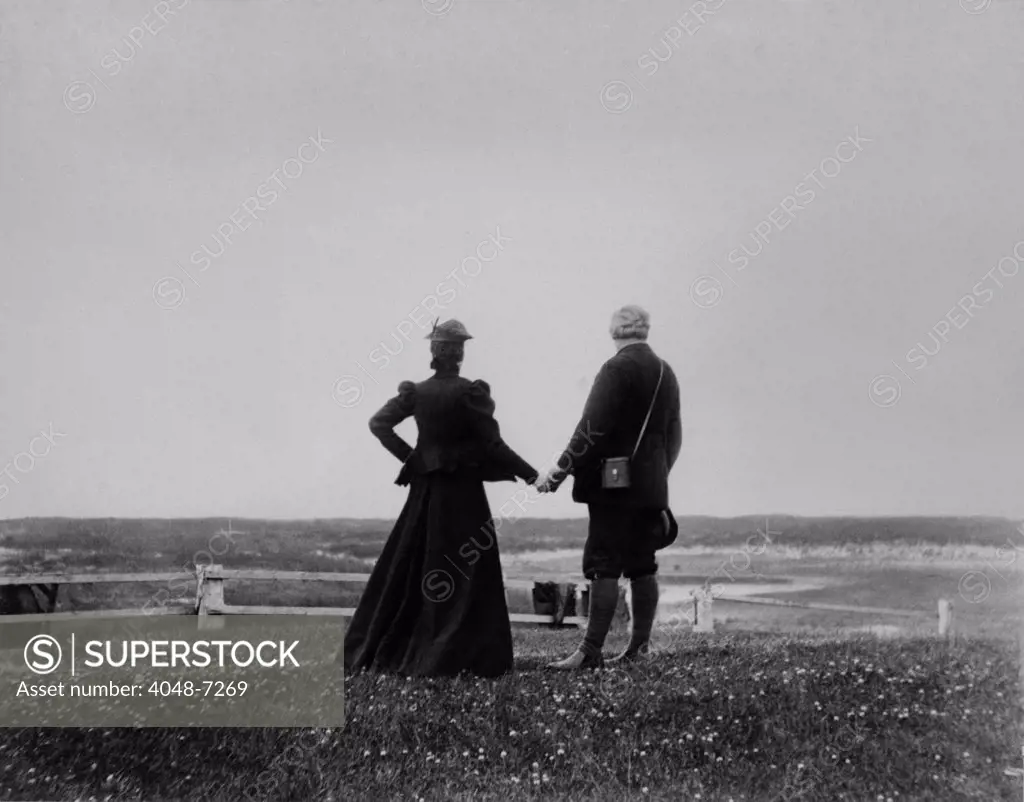 Alexander Graham Bell and Mabel Hubbard Bell hold hands and look toward the sea from Sable Island, Canada in 1898. Mable lost her hearing from scarlet fever at age five, and met Bell when she was his 15 year old student. They married five years later.