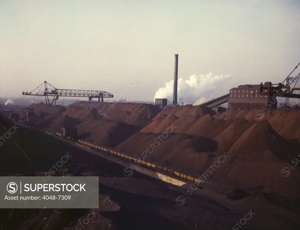 Massive stock pile of coal and iron ore, at the Hanna furnaces of the Great Lakes Steel Corporation in Detroit, Michigan. 1942.
