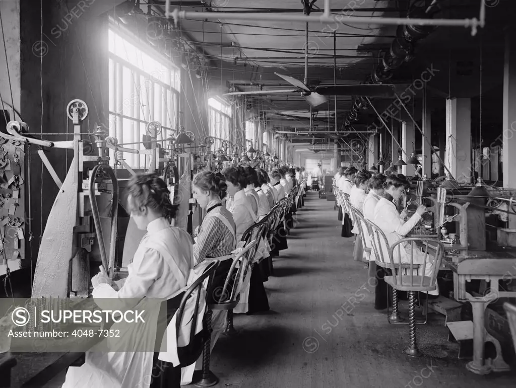 Lock and drill department assembly line of women workers at National Cash Register, Dayton, Ohio. C. 1902.