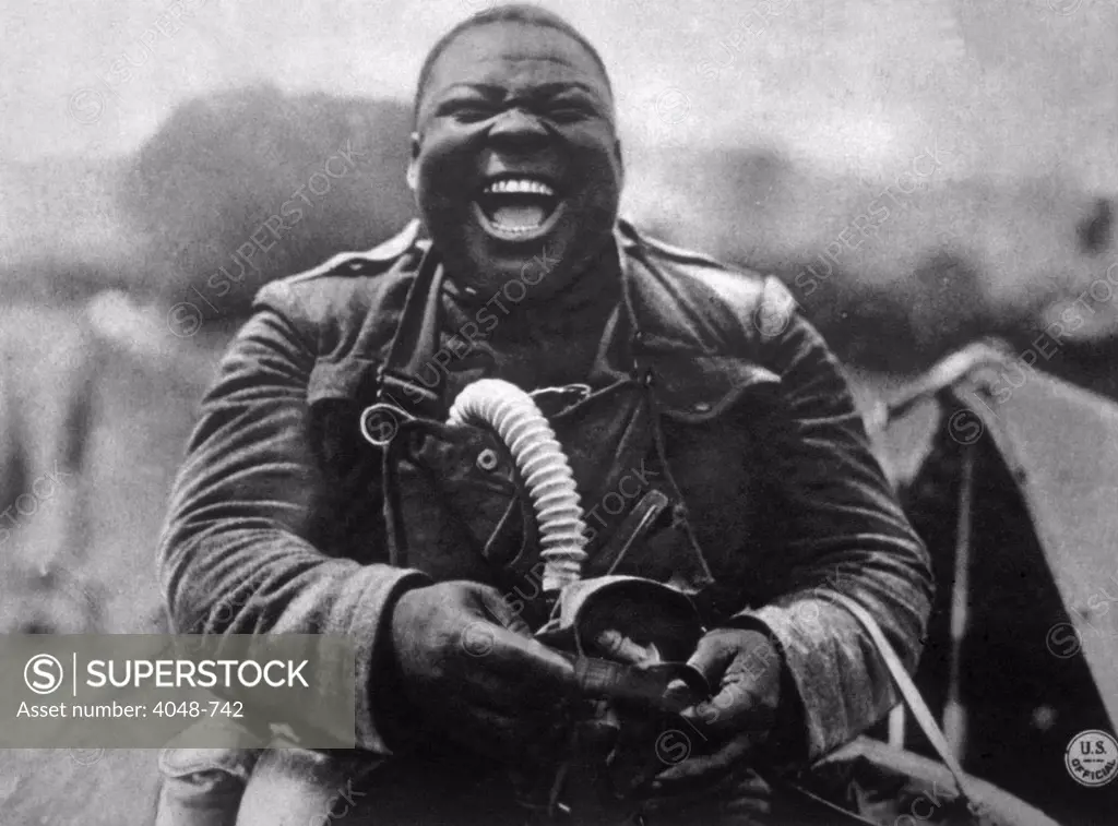 World War I, soldier of the African-American 3rd Battalion, 366th infantry with his gas mask, U.S. Signal Corps photograph