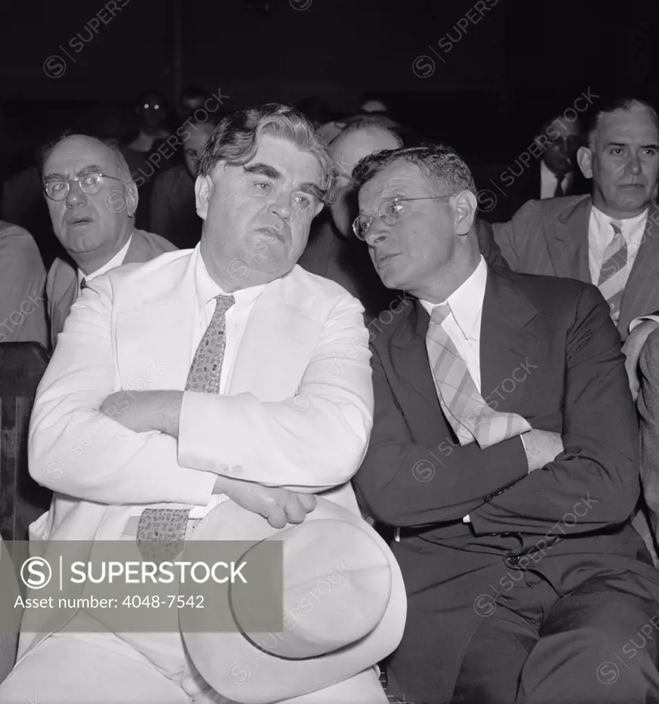 Labor leaders, John L. Lewis and Sidney Hillman, put their heads together during a meeting in Washington, D.C., in 1938 or 1939.