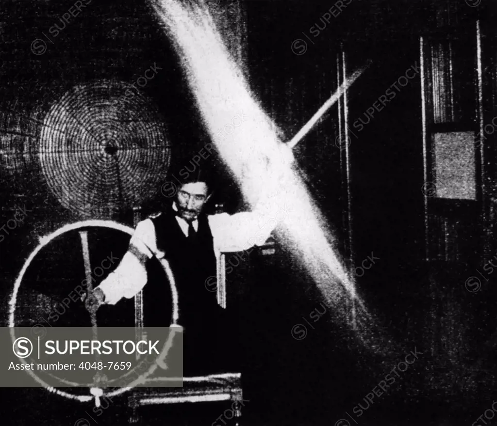 Nikola Tesla 1856-1943 conducted spectacular demonstrations of electricity. This image published in ELECTRICAL REVIEW in 1899 was accompanied by with this caption The operator's body in this experiment is charged to a high potential by means of a coil responsive to the waves transmitted to it from a distant oscillator.