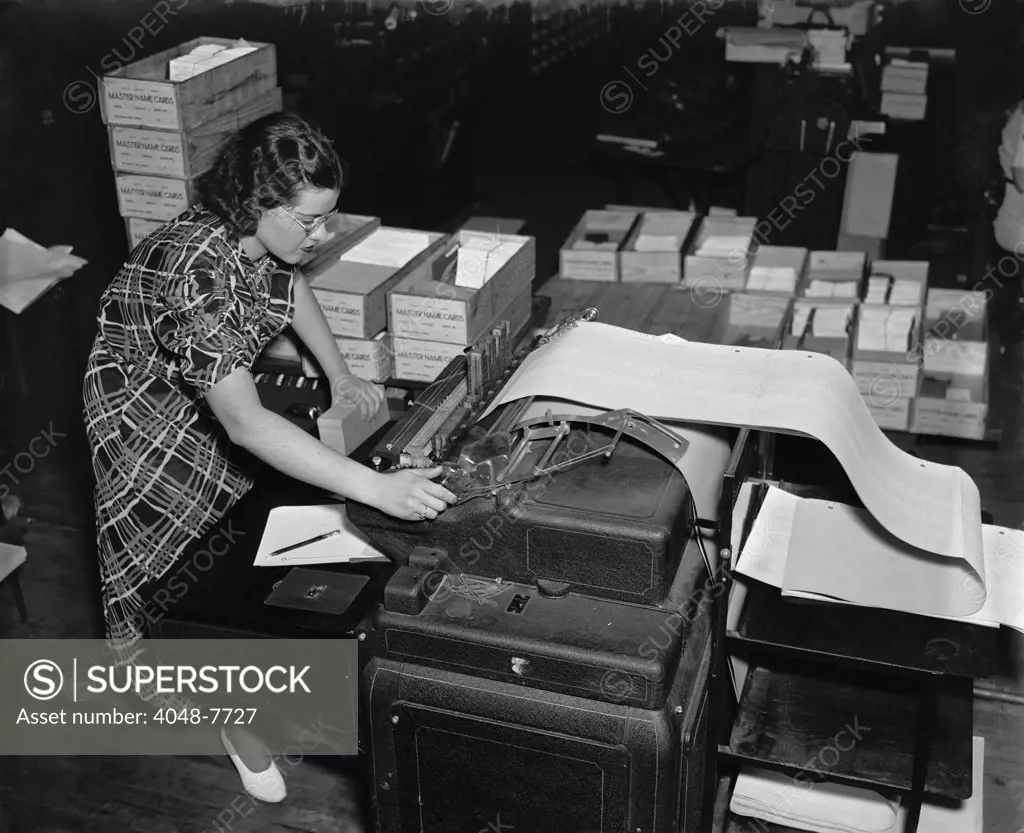 The new Social Security Administration was challenged with handling an unprecedented amount of information to track citizens' wage records and taxes paid. A government worker uses a state of the art mechanical tabulator to print a list Social Security account numbers. Ca. 1937.