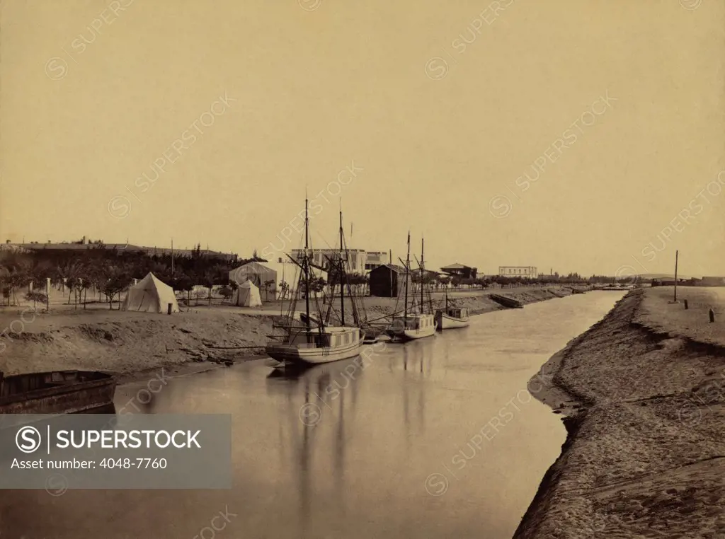 Small boats moored at water's edge to the Suez Canal at Ismailia. The Ismailia segment of the modern canal was completed in November 1862. 1860 photo by Francis Frith. LC-DIG-ppmsca-04470