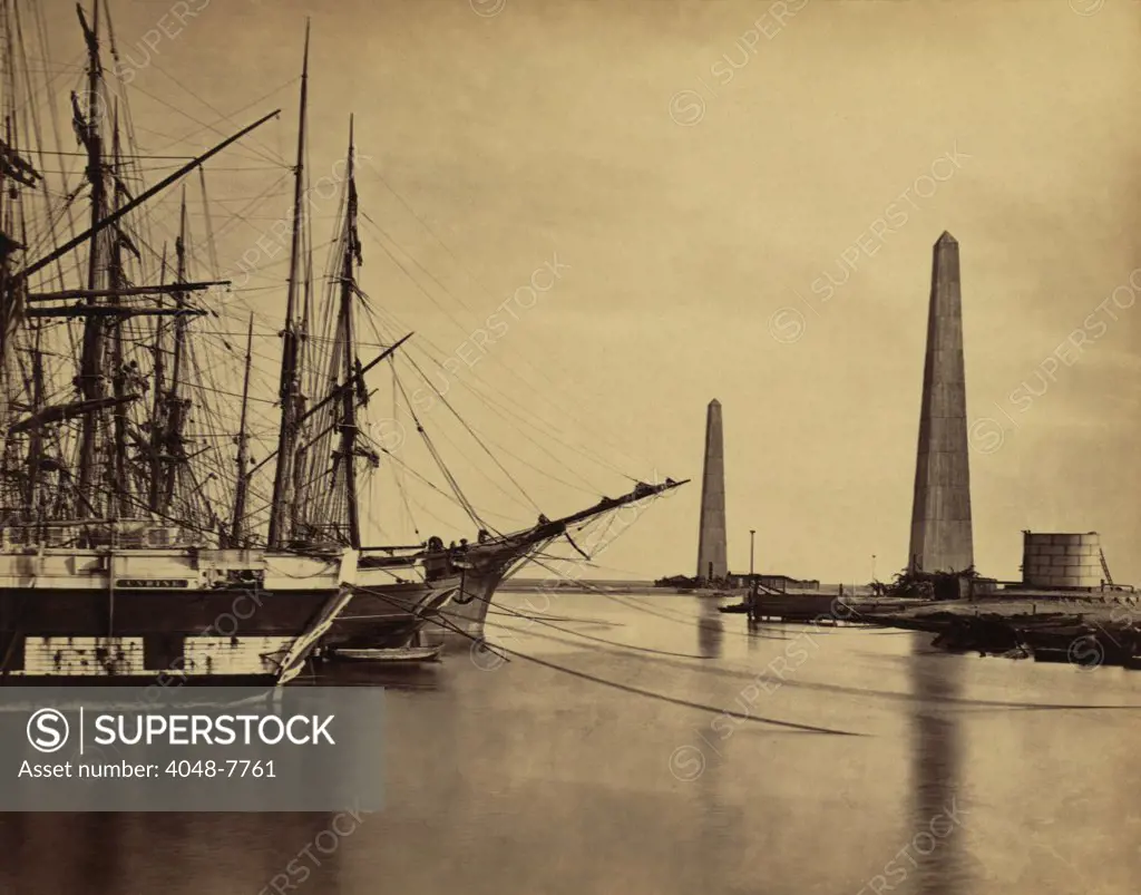 Obelisks on shore and ships moored at the Port Said entrance to the Suez Canal. 1860 photo by Francis Frith. LC-DIG-ppmsca-04472