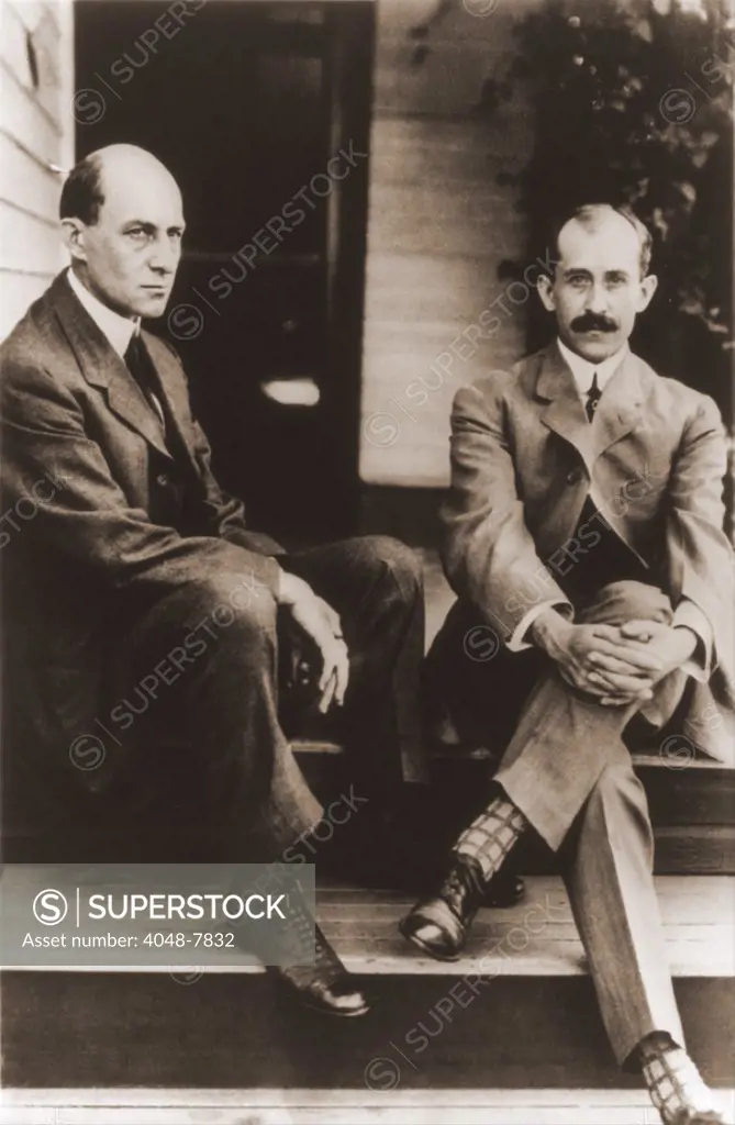 Wilbur Wright and Orville Wright on the porch steps of their house in Dayton Ohio. 1909. LC-USZ62-65478