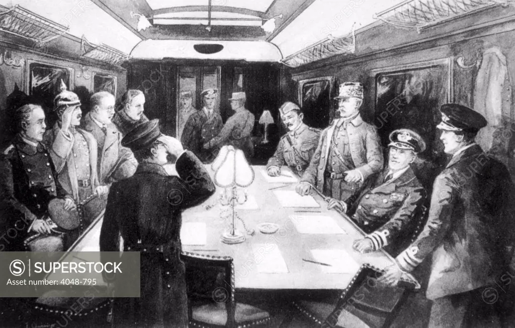 World War I, the signing of the Armistice in the railway car at Compiegne, France, included in picture are General Maxime Weygand, Marshal Ferninand Foch, Sir Rosslyn Wemis, and Admiral George Hope at right, November 11, 1918