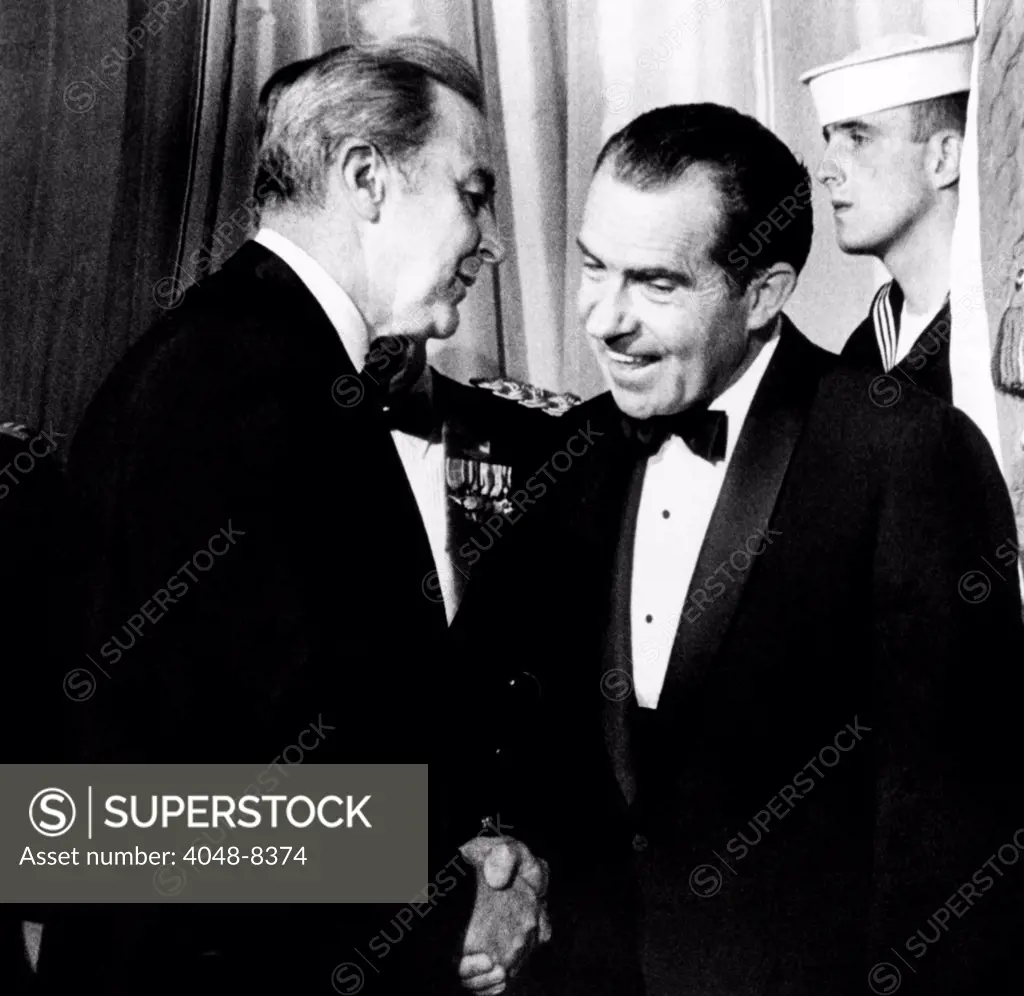 President Richard Nixon shakes hands with Sen. Eugene McCarthy at a White House reception for Congress. McCarthy's victory in the New Hampshire Democratic primary instigated Lyndon Johnson withdrawal from the 1968 Presidential election. March 12, 1969