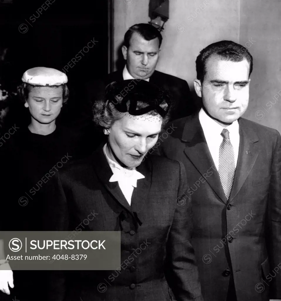 Vice President Richard Nixon and wife Pat, leaving the East Whittier Friends Church. They attended funeral services for the Vice Presidents father and are followed by his brother, Don, and his wife. Sept. 4, 1956.