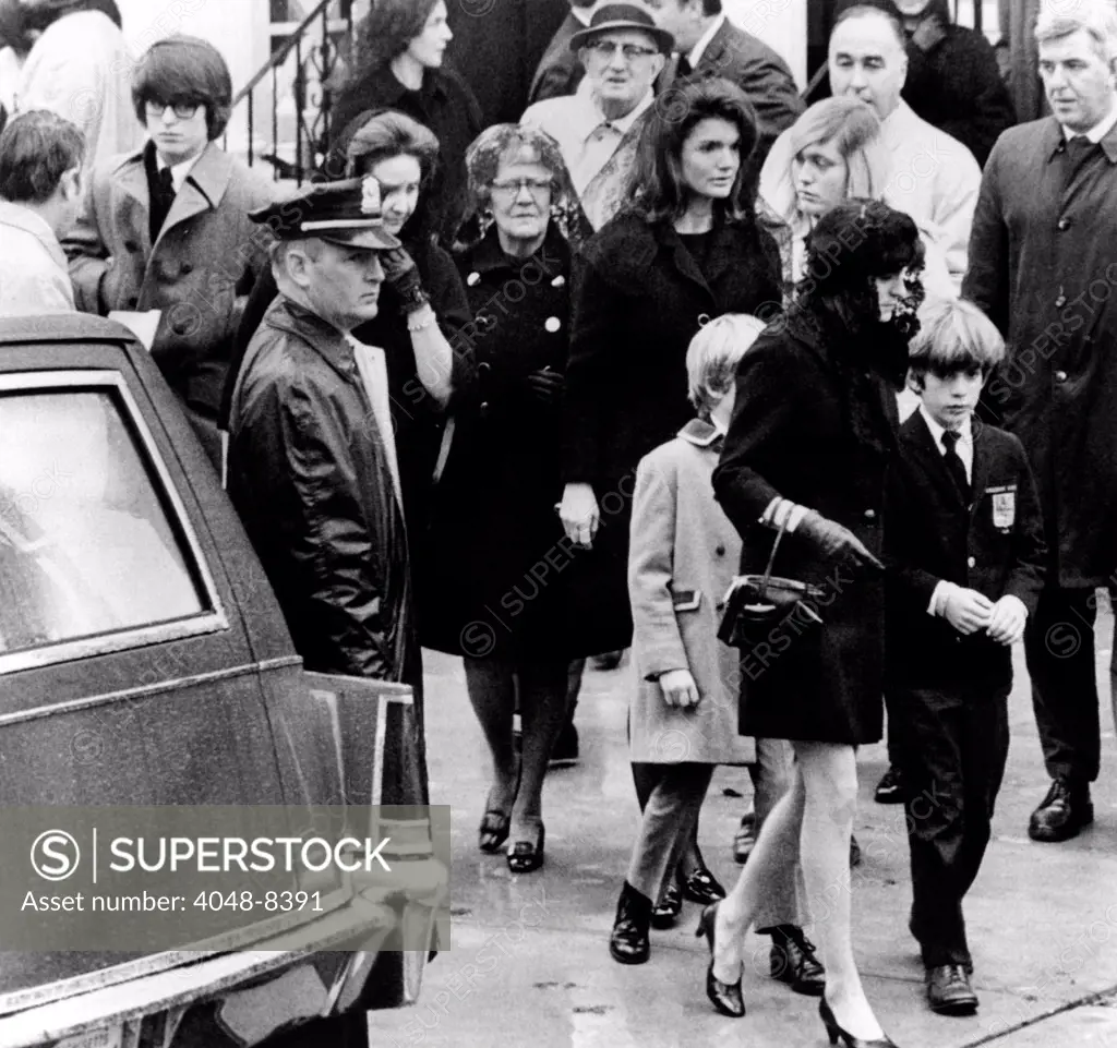 Kennedy family at the funeral of Joseph P. Kennedy. In the center is Jacqueline Kennedy Onassis and son, John, Jr., who is with Ann Gargan. At far left is Robert Kennedy Jr., son of the late senator. Others are unidentified. Nov. 18. 1969.