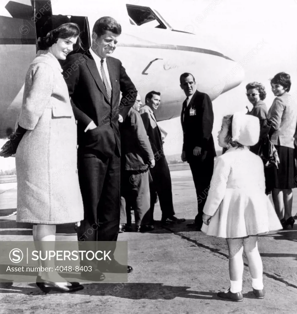 Democratic Presidential nominee John Kennedy says goodbye to his wife Jacqueline and daughter Caroline before leaving for the final days of the 1960 campaign. Mrs. Kennedy is seven months pregnant with John F. Kennedy Jr. Oct. 30, 1960