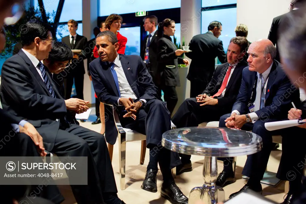 President Barack Obama meets with President Hu Jintao of China, on the margins of the G20 Summit in Cannes, France, Nov. 3, 2011. At right are Treasury Secretary Timothy Geithner and Chief of Staff Bill Daley.