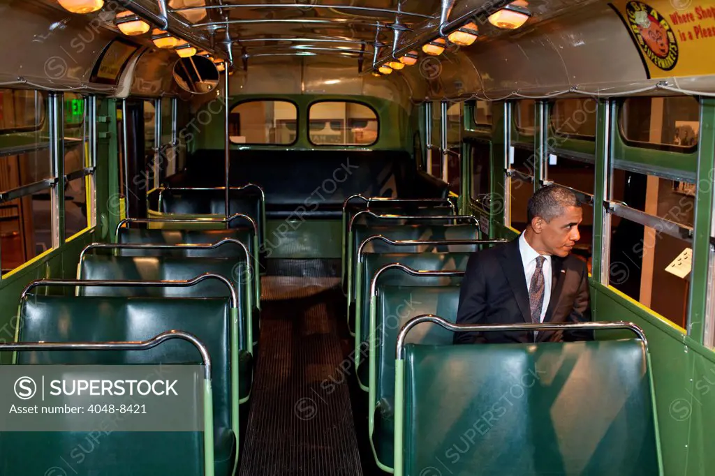 President Barack Obama sits on the famed Rosa Parks bus at the Henry Ford Museum following an event in Dearborn, Mich., April 18, 2012.