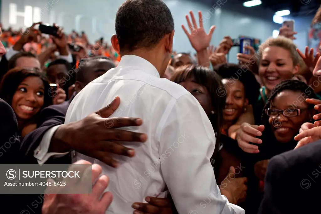 President Barack Obama greets audience members after delivering remarks on the economy at the University of Miami Field House in Coral Gables, Fla., Feb. 23, 2012.