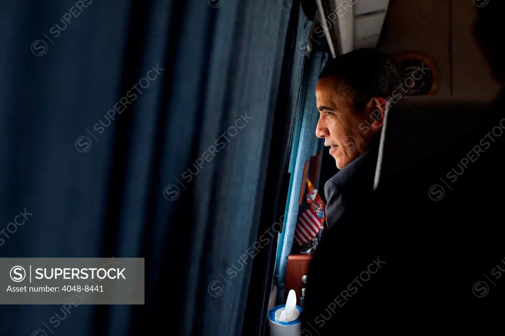 President Barack Obama looks out the window of Marine One as he departs the White House South Lawn en route to Joint Base Andrews, Md., for a trip to Vermont, March 30, 2012.
