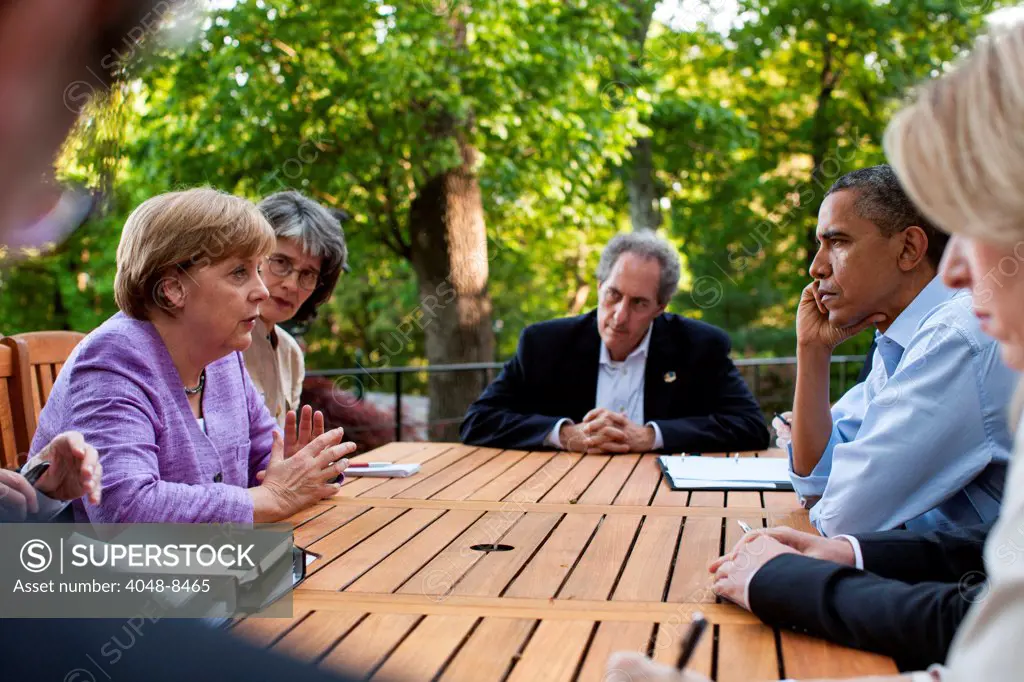 President Barack Obama and Chancellor Angela Merkel of Germany participate in a bilateral meeting on the Aspen Cabin patio during the G8 Summit at Camp David, Md., May 19, 2012
