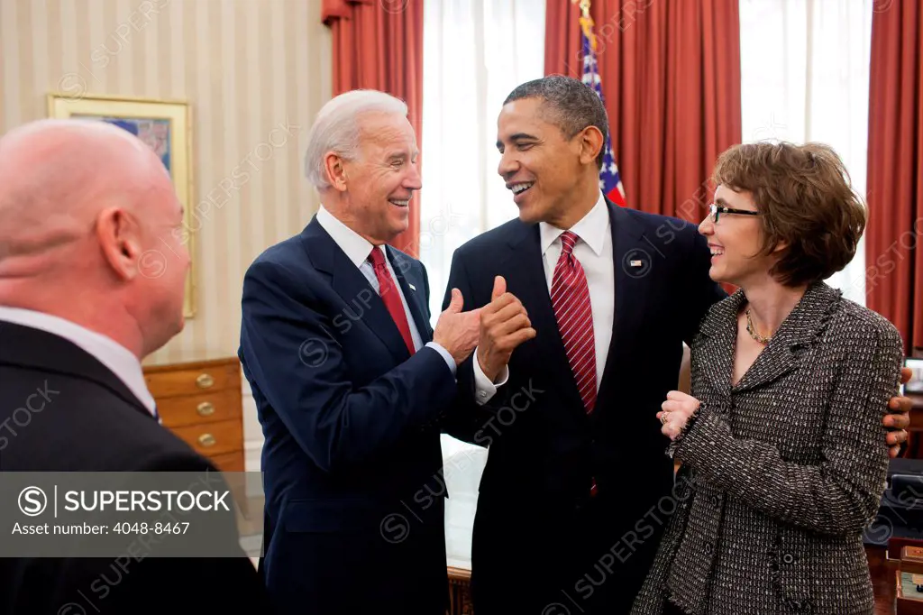 President Barack Obama and Vice President Joe Biden talk with former Representative Gabrielle Giffords and her husband, Mark Kelly, after the President signed H.R. 3801, the last piece of legislation that Giffords sponsored and voted on.