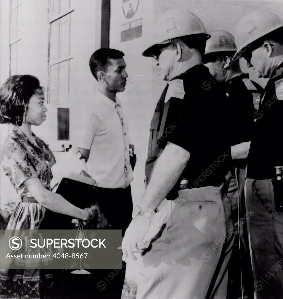 African Americans refused admission to Murphy High School. Dorothy Bridget Davis and Henry Hobdy were blocked by state troopers acting under orders of Governor George Wallace. Mobile, Alabama. 1963.