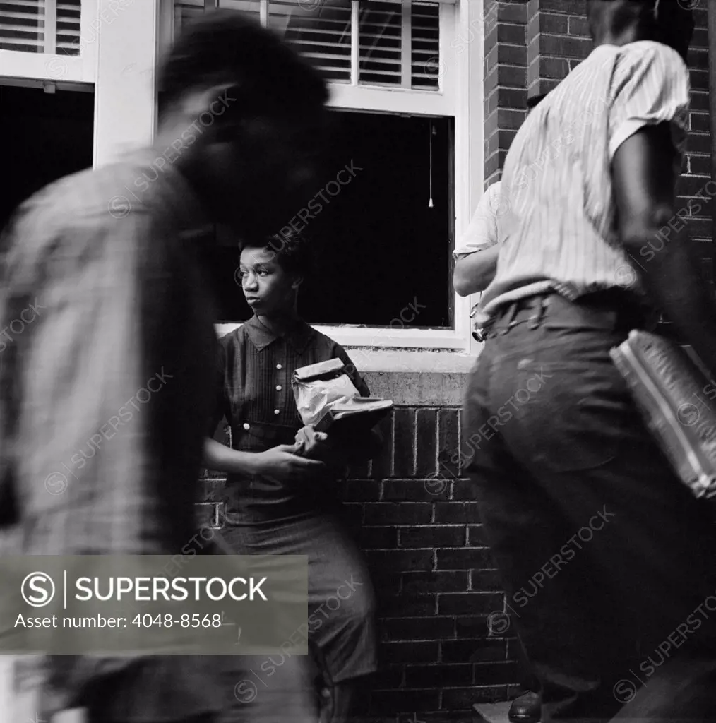 In spite of earlier protest and harassment, African American students arrive at Van Buren High School, Little Rock's second largest. Sept. 9, 1958.