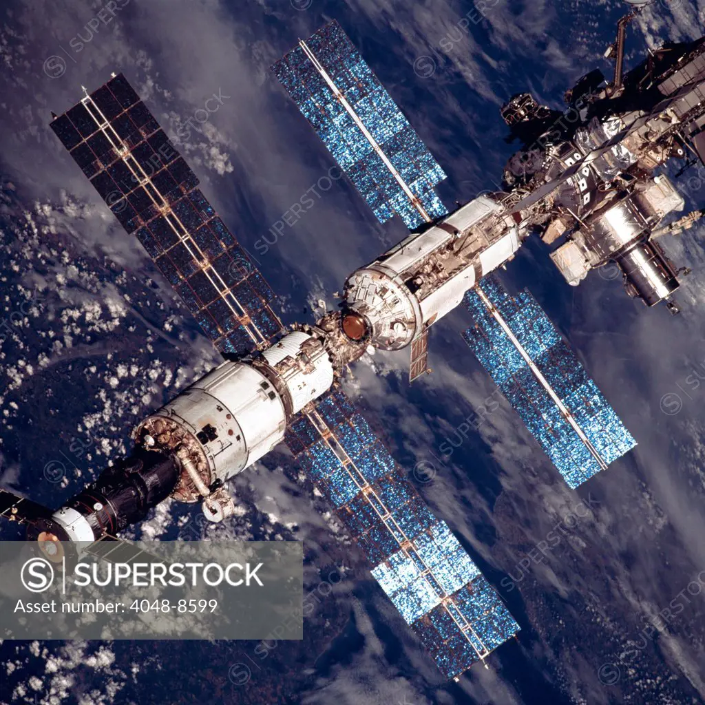International Space Station in 2001. Overhead close-up view of the expanded International Space Station. At lower left a Russian Soyuz capsule is docked.