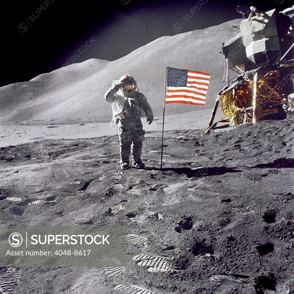 Apollo 15 Astronaut David Scott, gives a military salute to US flag on the Moon. July 30, 1971.