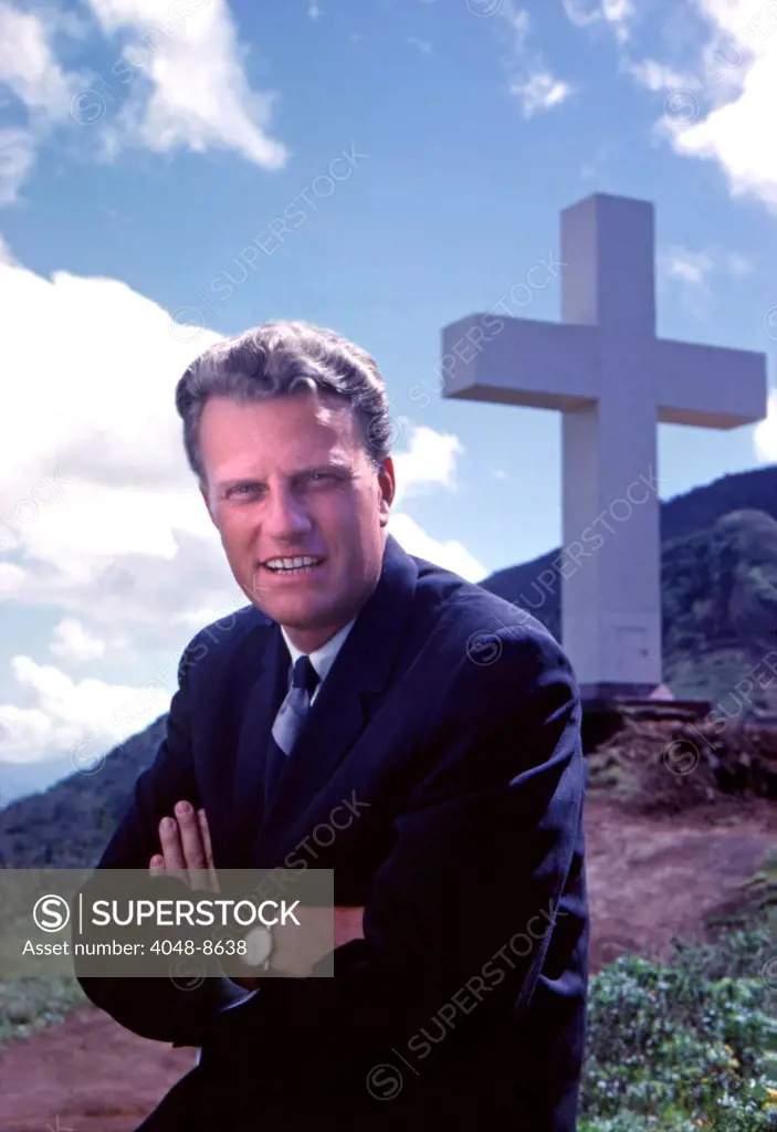 Billy Graham in front of the Kolekole Cross at the U.S. Army's Schofield Barracks at Kolekole Pass, Oahu, Hawaii, 1963. Photo: John G. Zimmerman Archive/Courtesy Everett Collection