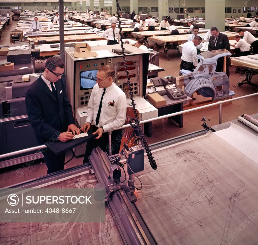 Precision drawings of each body part of a new Ford automobile are scanned by the coordinatograph (foreground). A computer then converts the coordinatograph's diagram measurements into instructions for the modeling of 3-D body sections. Ford Motor Company, Dearborn Michigan, 1966. Photo: John G. Zimmerman Archive/Courtesy Everett Collection