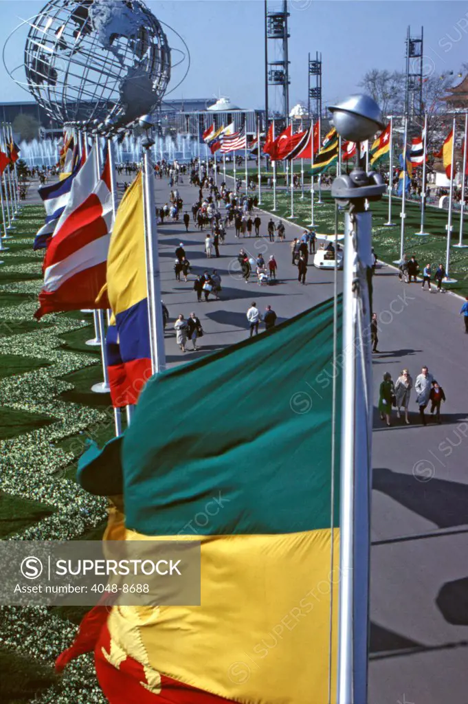 World's Fair, New York, 1964. View down the colorful Avenue of Flags towards the Unisphere. Flushing Meadow Park, Flushing, Queens, NY. Photo: John G. Zimmerman Archive / Courtesy Everett Collection