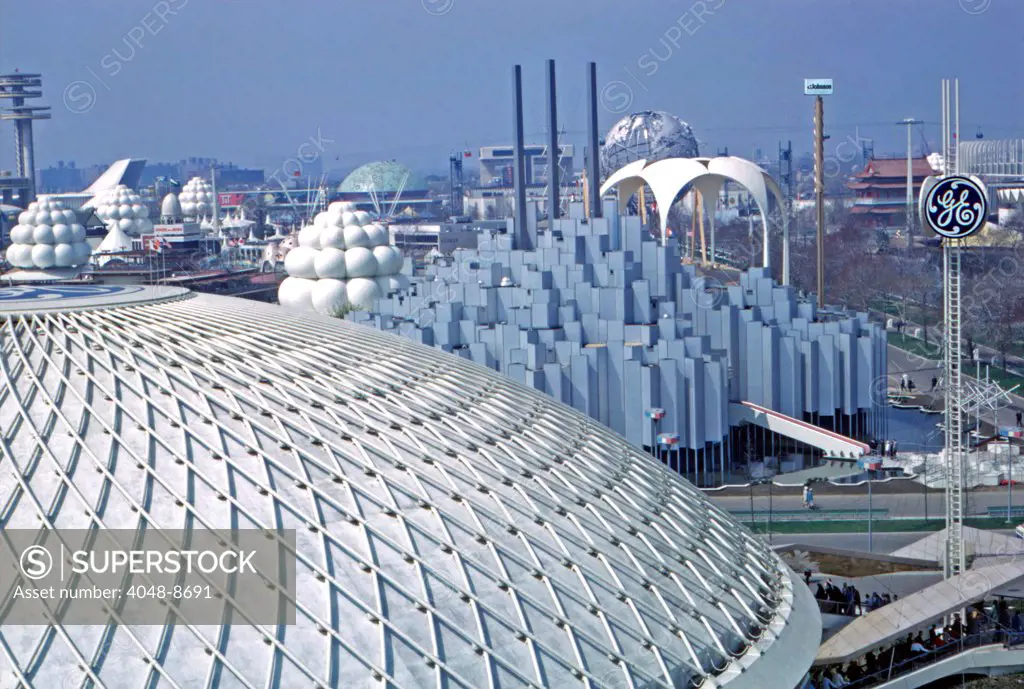 1964 World's Fair, Flushing Meadows, New York. Dome of General Electric Pavillion, foreground,  with the Tower of Light, Johnson Wax Pavillion designed by Architect Phillip Johnson and Unisphere behind on right. Photo: John G. Zimmerman Archive / courtesy Everett Collection