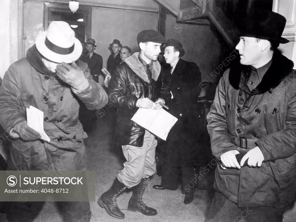 J. Edgar Hoover arriving in St. Paul, Minn. at the tragic end of the Charles S. Ross Kidnap case. After collecting a $50,000 ransom, John Henry Seadlund then killed Ross, as well as his criminal partner, James Atwood Gray. Special FBI agent Earl Connelley (in center) cracked the case, and arrested Seadlund. Jan. 21. 1938.