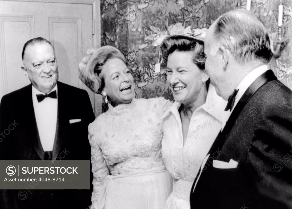 FBI Director J. Edgar Hoover attended a dinner honoring Mrs. Martha Mitchell. The controversial wife of the attorney general John Mitchell, was honored by American Women's Newspaper Club. L-R: Hoover, Mrs. Mitchell, Minnie Pearl, John Mitchell. May 24, 1971.